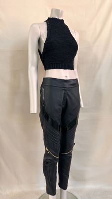 the mannequin is wearing black leather pants and a cropped top