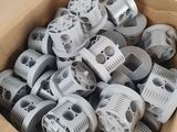 a cardboard box full of plastic wheels and wheels