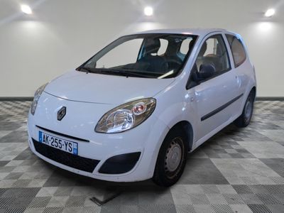 a picture of a small white car parked in a garage