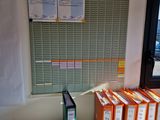 a desk with a bunch of folders on it