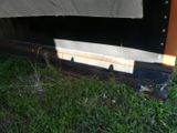 a close up of a truck with a tarp on it ' s side