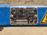 a close up of a sign on the side of a blue bike