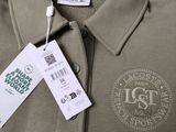the label on a polo shirt is attached to the collar