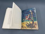 an open book with a picture of a man riding a horse