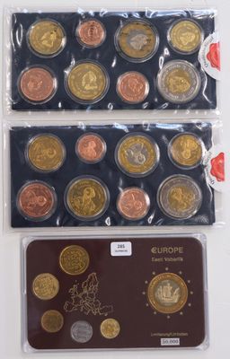 a close up of a bunch of different colored coins on a table