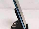 a cell phone that is on a stand on a table