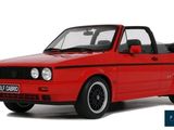 the red car is parked on a white surface with a white background