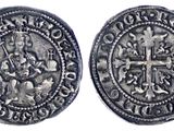 une pièce d'argent avec une croix au recto et une croix au verso