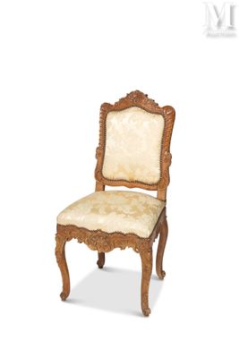 an image of a wooden chair with a beige upholstered seat