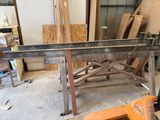 an image of a workbench in a workshop with a lot of wood