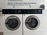 a picture of a washer and dryer in a public bathroom