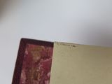a person holding a piece of paper in their hand