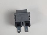 a close up of a black electrical connector on a white surface