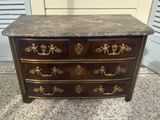 an antique chest of drawers with marble top and brass handles