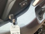 a close up of a motorcycle seat with a tag attached to it