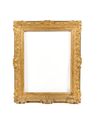 an antique gold frame with a white background