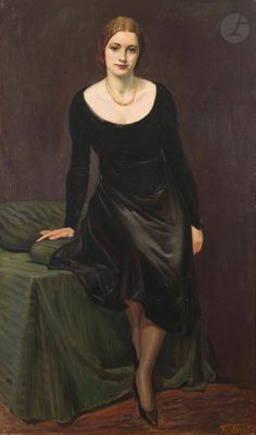 portrait of a woman in a black dress sitting on a green chair