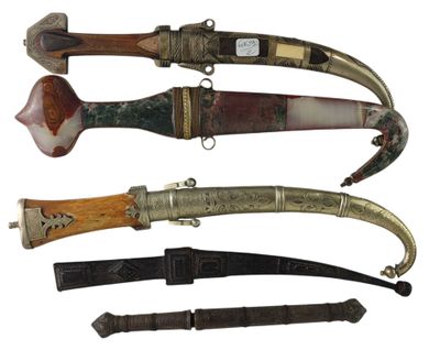 several different types of knifes are displayed on a white surface