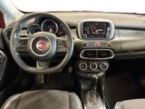 the interior of a small car with a steering wheel and dashboard controls