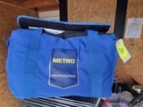 a blue tote bag with a metro logo on it