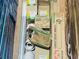 a lot of boxes and a pair of scissors on the floor
