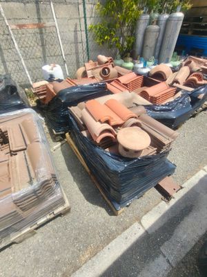 many different types of roof tiles on the ground