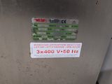 an image of a stainless steel refrigerator with a sticker on it