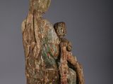 an image of a statue of a woman holding a child