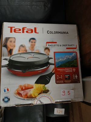 a box of tefal cooking utensils on a table