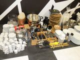 a table with many different types of kitchenware and utensils