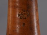 a close up of a wooden baseball bat with a logo on it