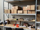 a room with a lot of boxes and boxes on the shelves