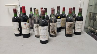 several bottles of wine are lined up on a counter