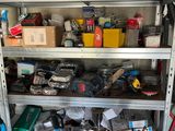 a metal shelf with various items on it in a garage