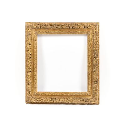 an antique gold frame with a white background