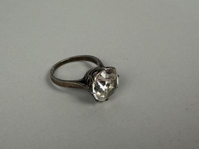 an image of a diamond ring on a white surface