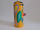 brightly colored spray can on white surface with white background
