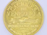 an image of a close up of a gold coin on a white surface