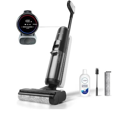 un aspirateur noir et argenté, avec une brosse à dents et du dentifrice