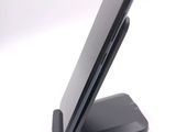 a cell phone that is sitting on top of a stand