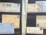 many different types of stamps on display in a glass case
