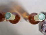 three bottles of wine sitting next to each other on a table