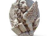a statue of a lion holding a book and a sword