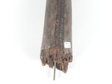 a wooden sculpture of a person holding a bird on a stick