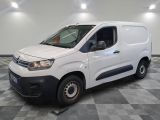the white van is parked on a checkered floor in a room