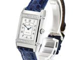 a close up of a wrist watch with a blue strap