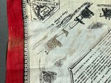 a red and white handkerchief with a picture of a plane