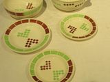 four bowls and a bowl with a lid on a table