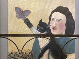 un tableau représentant une femme tenant un chat devant une fenêtre