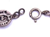 an image of a close up of a bracelet on a white surface